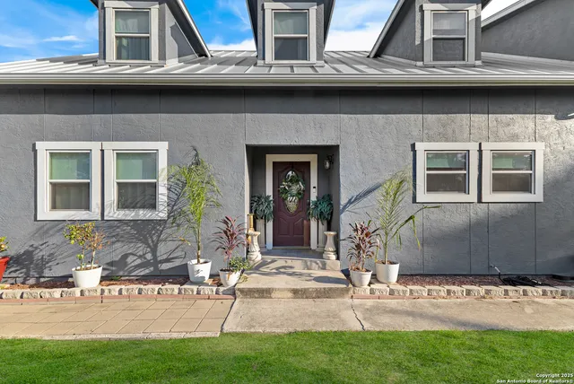 a view of house with outdoor space and seating space