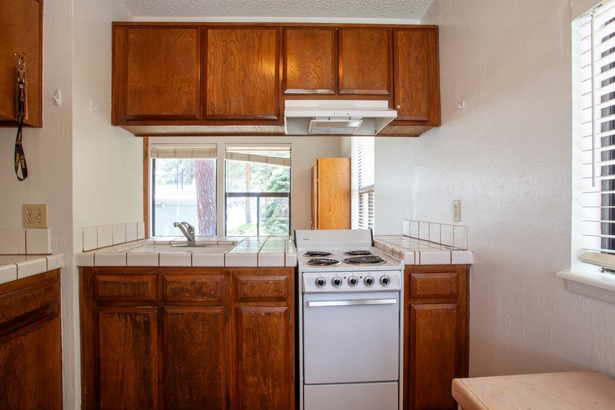 56 Davison Road, Unit 104 Mammoth Lakes, CA 93546 - Photo 9 of 22 a bathroom with a sink a toilet and mirror