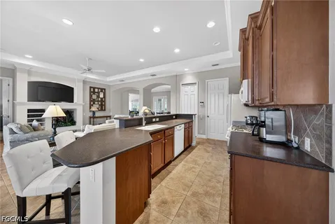a kitchen with stainless steel appliances a refrigerator sink and stove