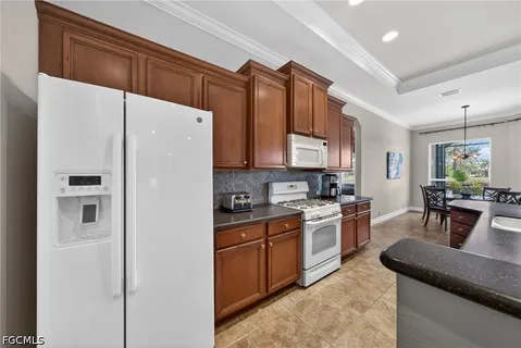 a kitchen with sink a table and chairs