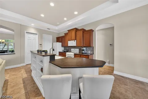 a view of a dining room and hall with furniture