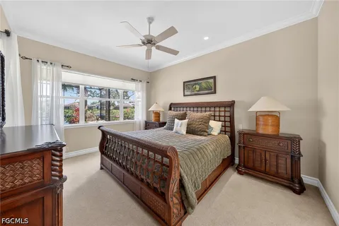 a bedroom with a bed and a lamp with the dresser