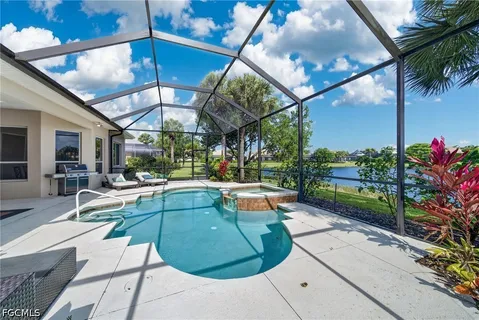 a view of a backyard with sitting area