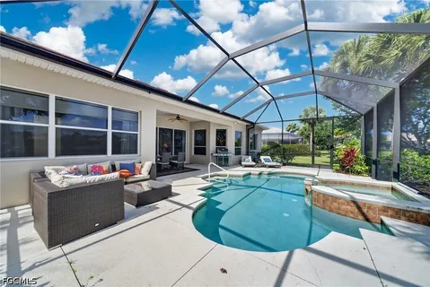 a view of a patio with swimming pool table and chairs
