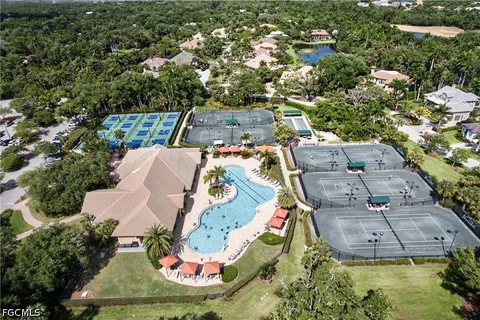 a view of a room with lots of furniture and lots of wooden floor