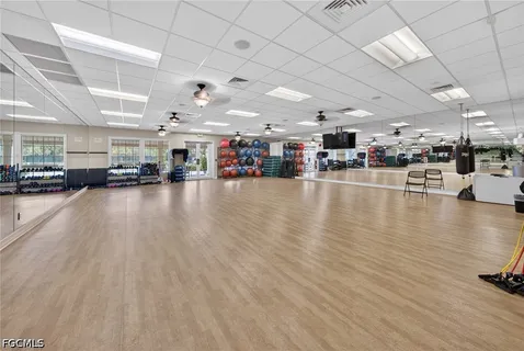 a view of a white house with a park