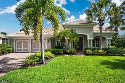 a living room with furniture and a dining table with kitchen view