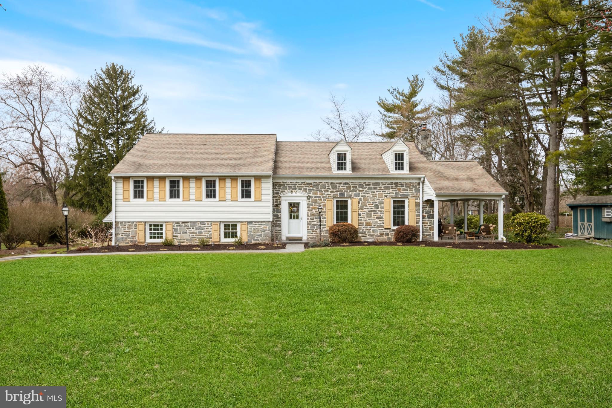 653 Baron Dekalb Road Wayne, PA 19087 - Photo 1 of 32 a front view of a house with a garden