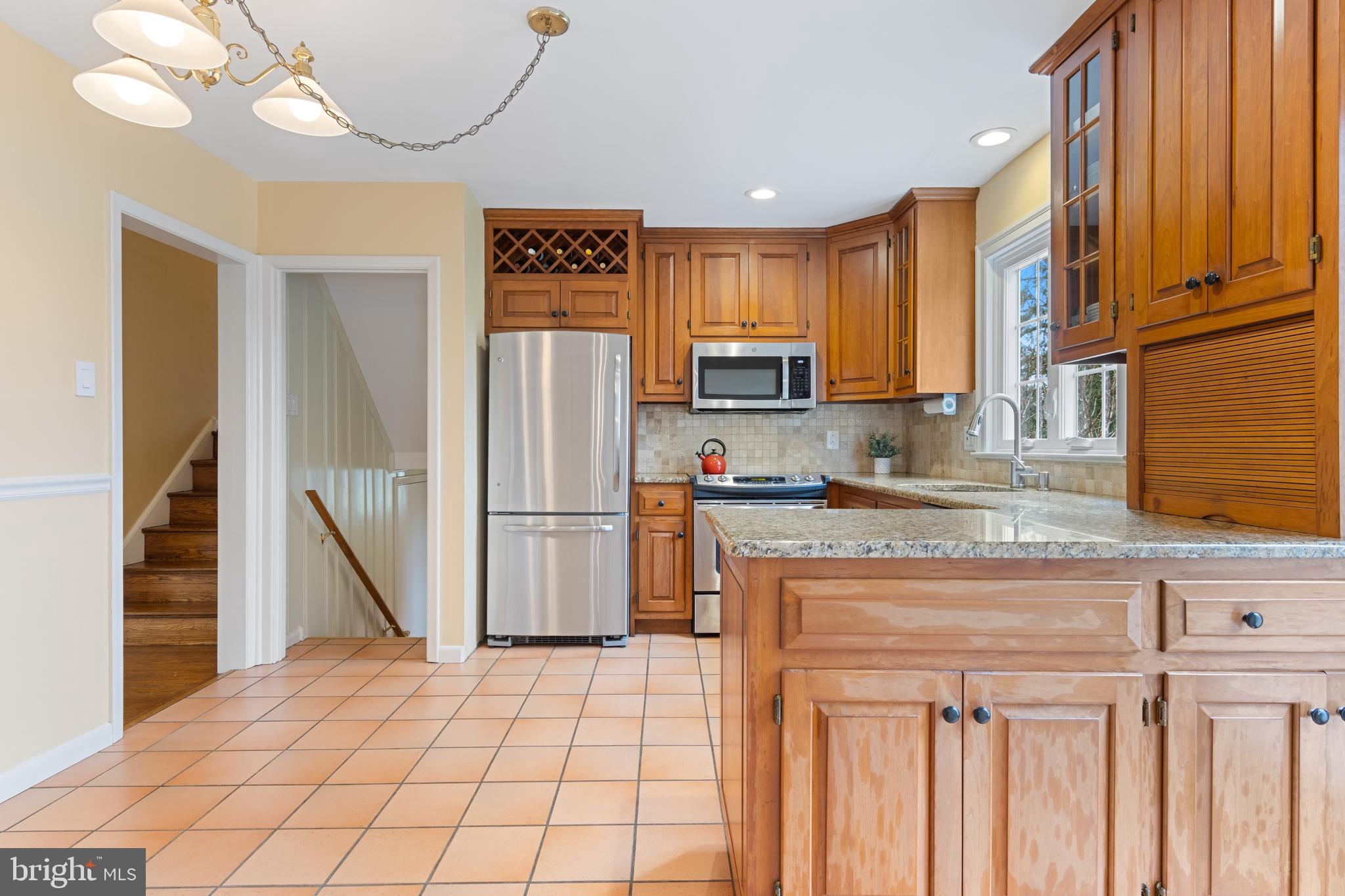 653 Baron Dekalb Road Wayne, PA 19087 - Photo 15 of 32 a kitchen with stainless steel appliances granite countertop a refrigerator a stove and a sink