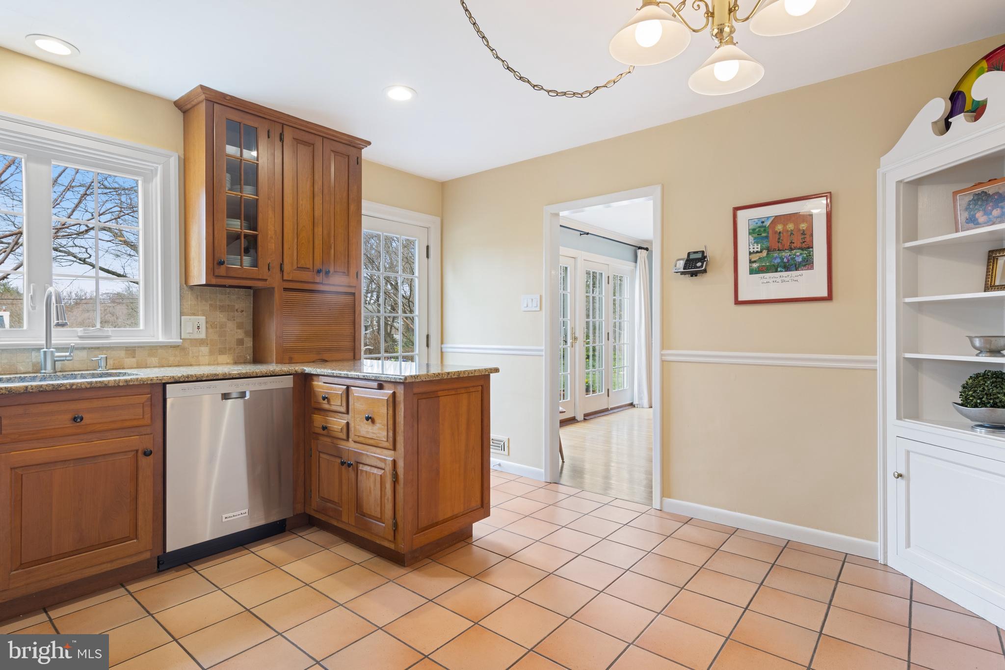 653 Baron Dekalb Road Wayne, PA 19087 - Photo 16 of 32 a kitchen with stainless steel appliances granite countertop a refrigerator and a stove top oven