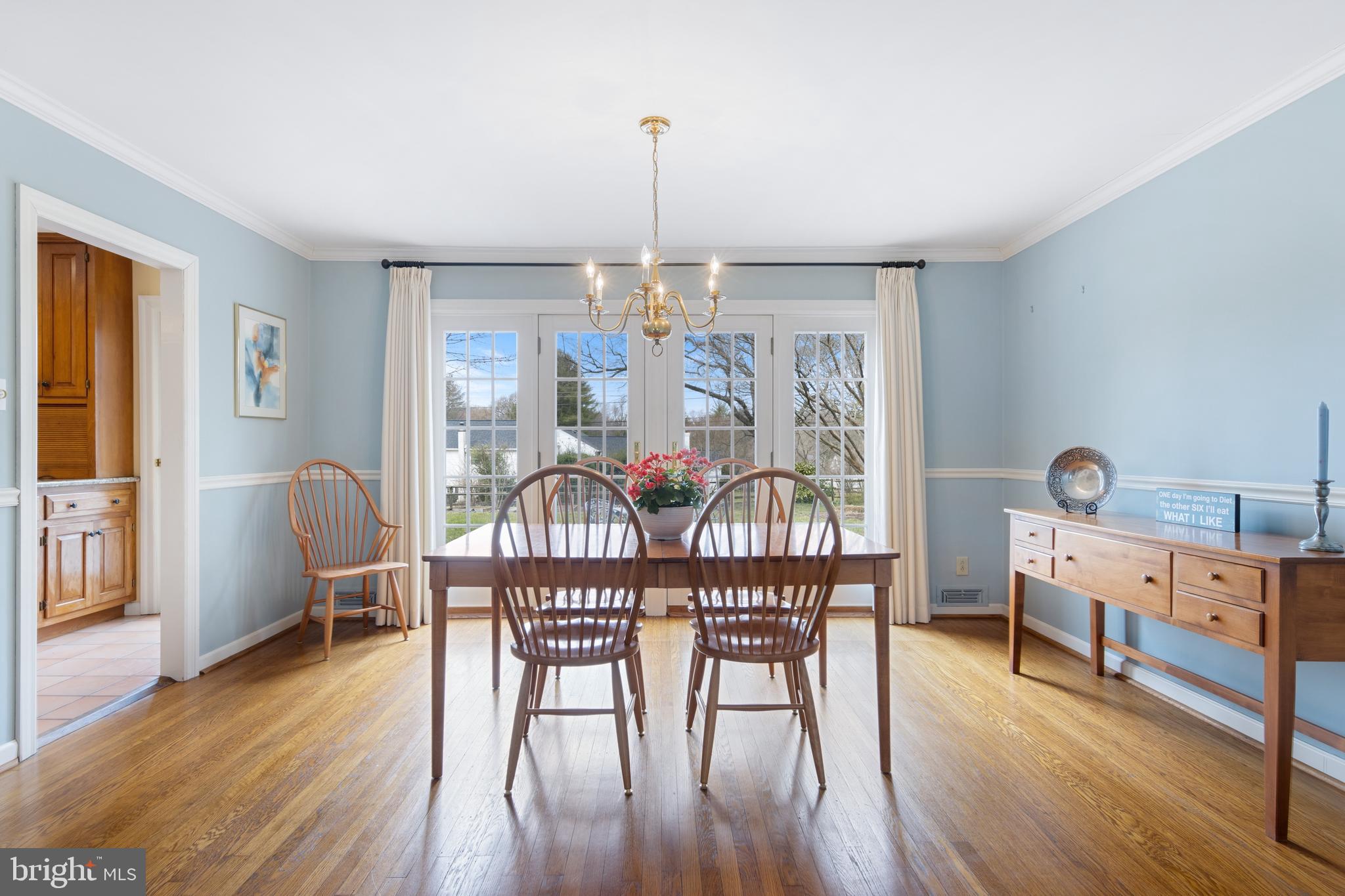 653 Baron Dekalb Road Wayne, PA 19087 - Photo 18 of 32 a dining room with furniture a chandelier and wooden floor