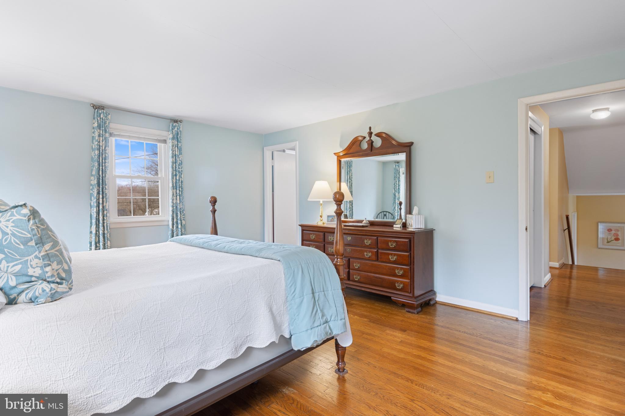 653 Baron Dekalb Road Wayne, PA 19087 - Photo 21 of 32 a bedroom with a bed and wooden floor
