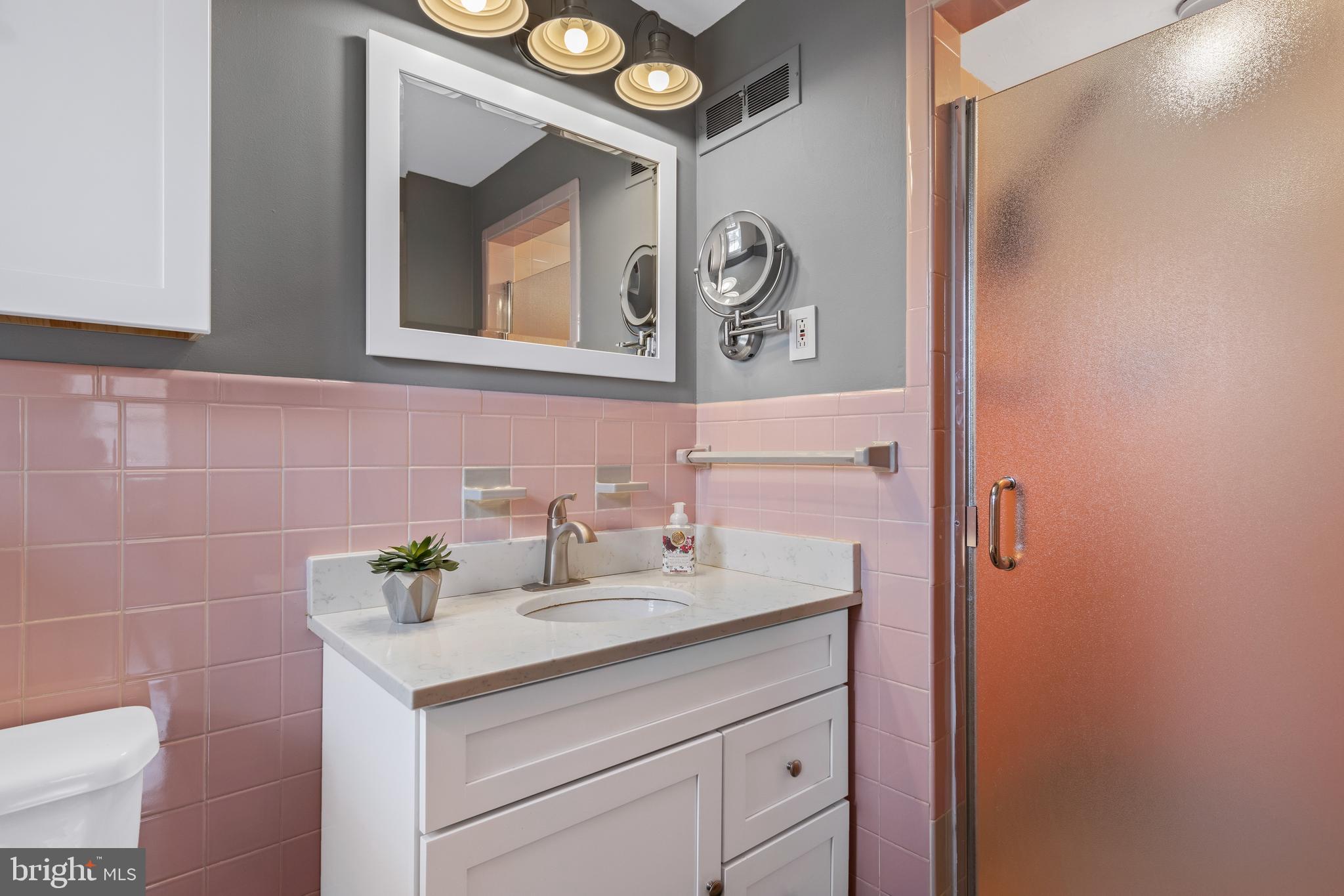 653 Baron Dekalb Road Wayne, PA 19087 - Photo 22 of 32 a bathroom with a sink and a mirror