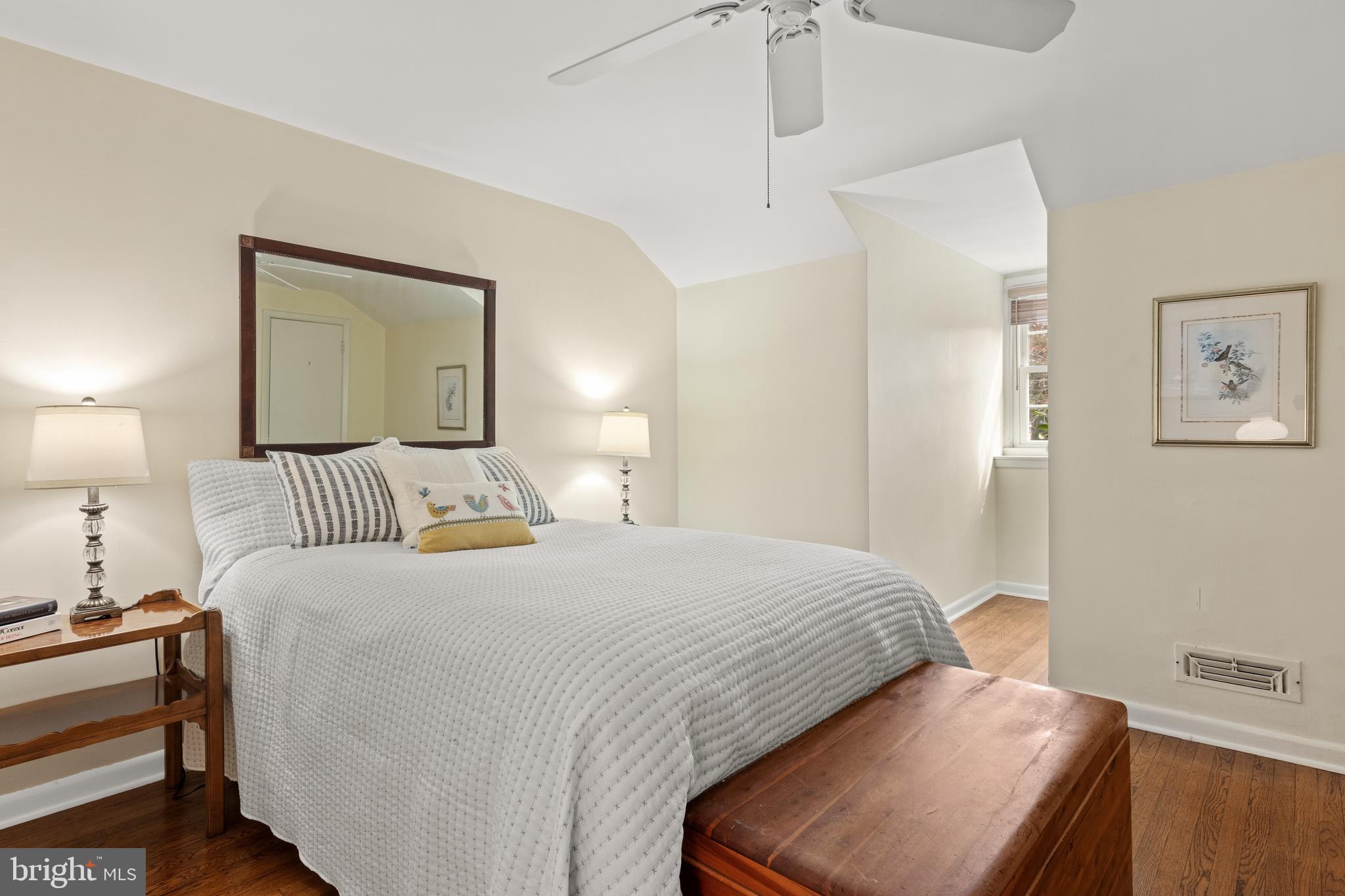 653 Baron Dekalb Road Wayne, PA 19087 - Photo 30 of 32 a bedroom with a bed and a lamp