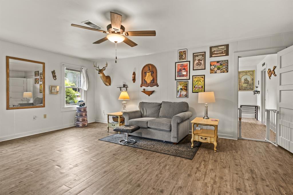103 South Sun Camp Road White Oak, TX 75693 - Photo 23 of 40 a living room with furniture and a wooden floor