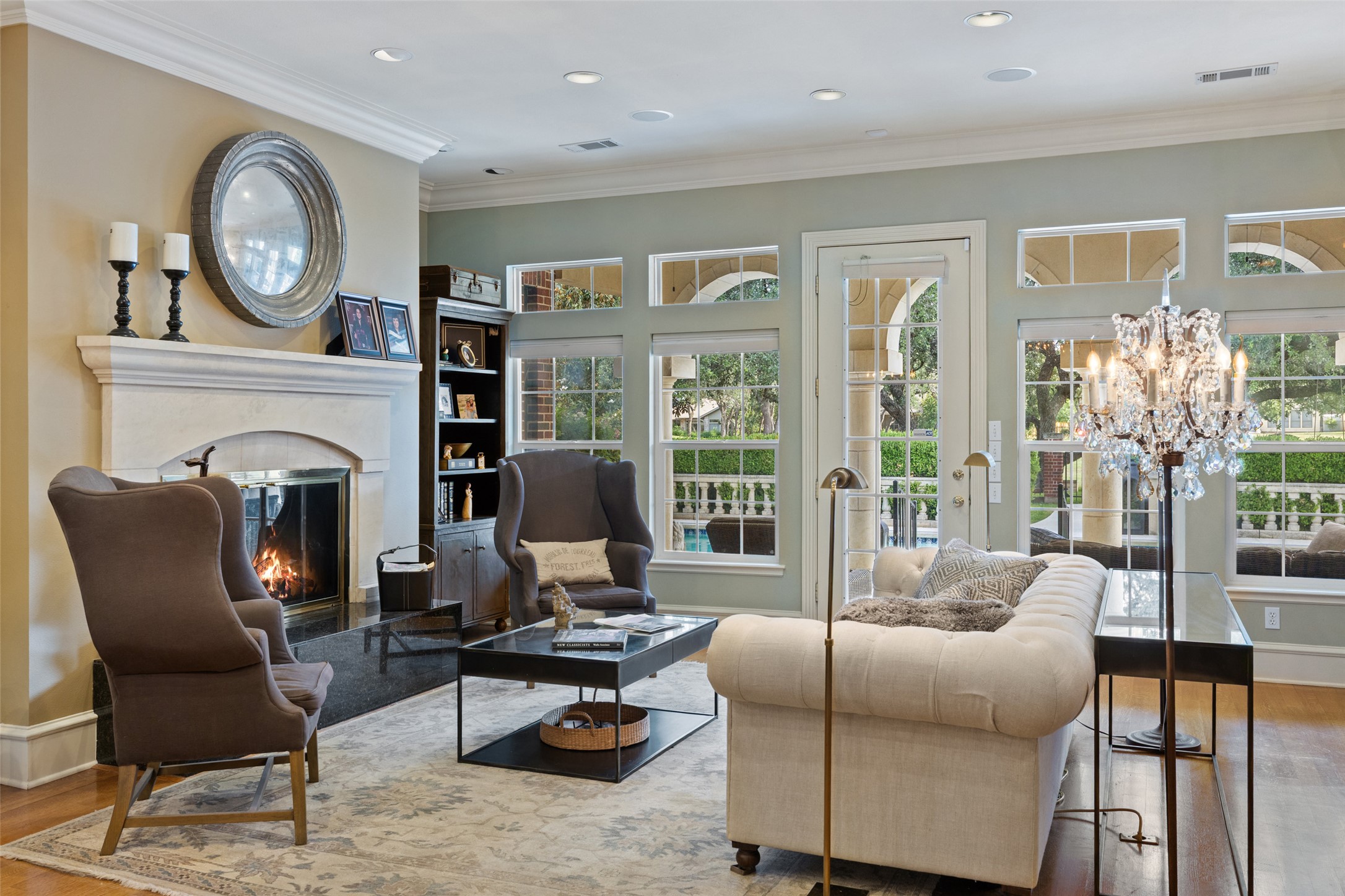 118 Lido Street Austin, TX 78734 - Photo 12 of 40 a living room with furniture a fireplace and a large window