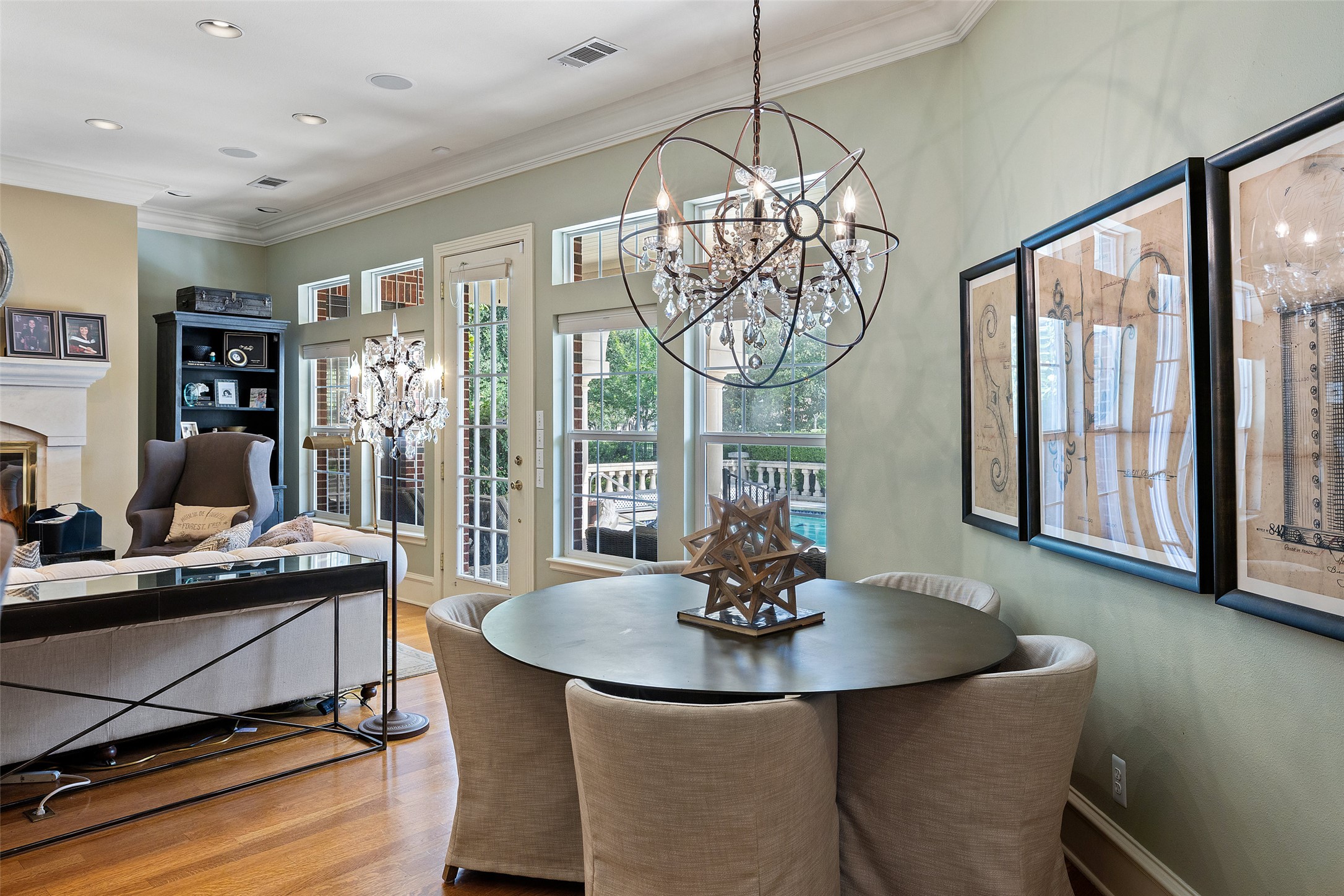 118 Lido Street Austin, TX 78734 - Photo 16 of 40 a dining room with wooden floor a chandelier a wooden table and chairs