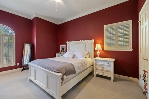 a bed room with a bed and a window