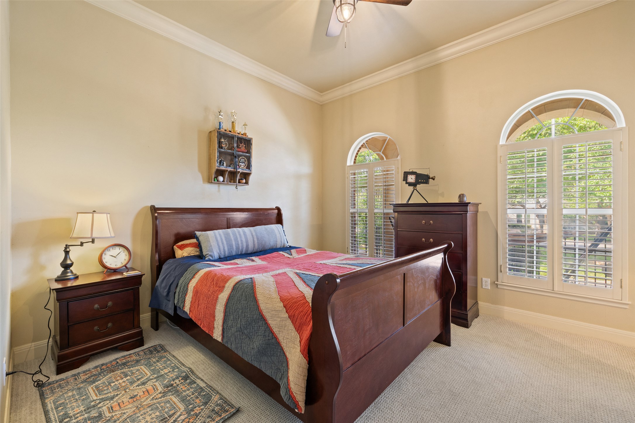 118 Lido Street Austin, TX 78734 - Photo 25 of 40 a bedroom with a bed and a chandelier