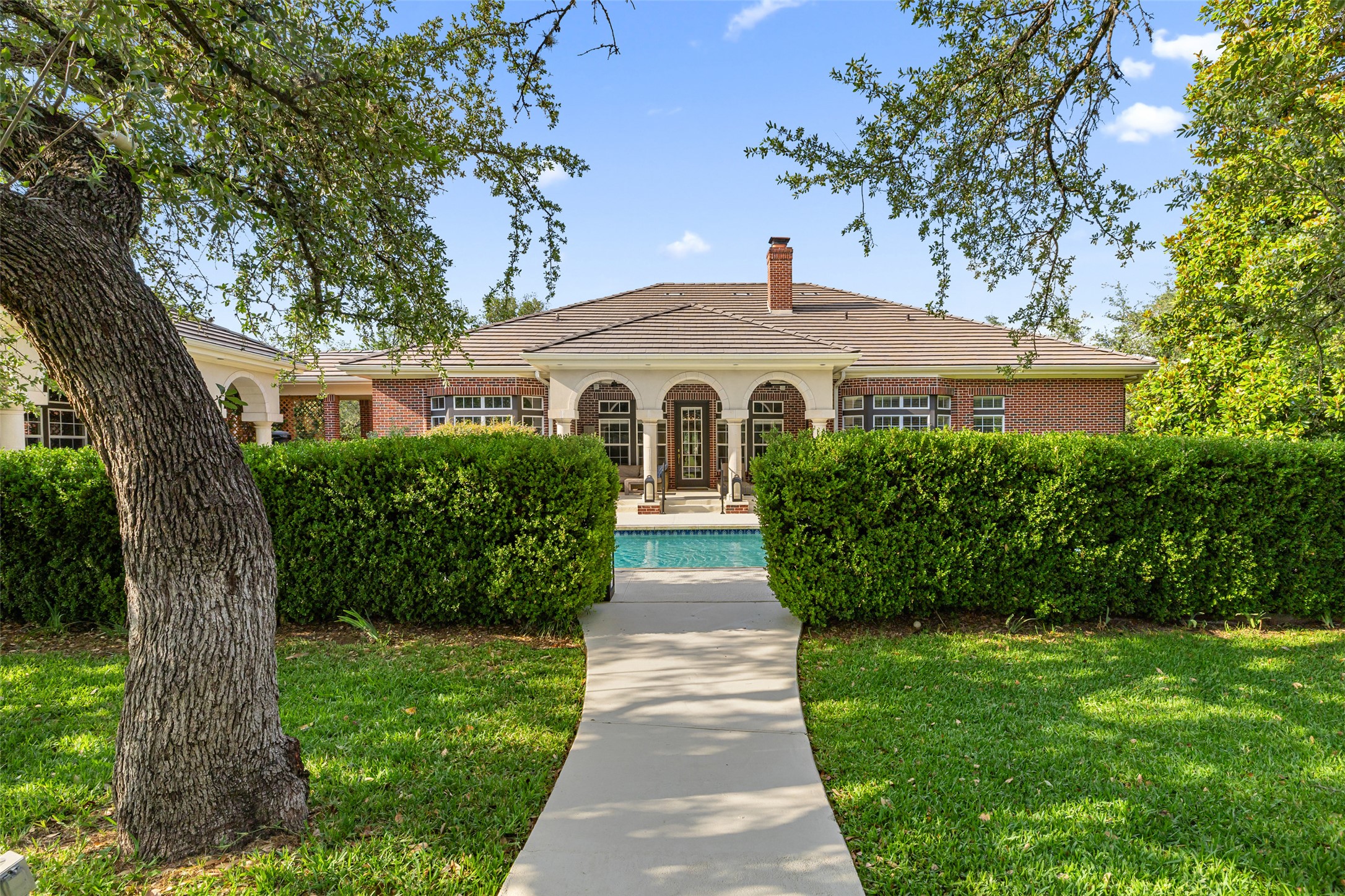 118 Lido Street Austin, TX 78734 - Photo 38 of 40 a front view of a house with a garden