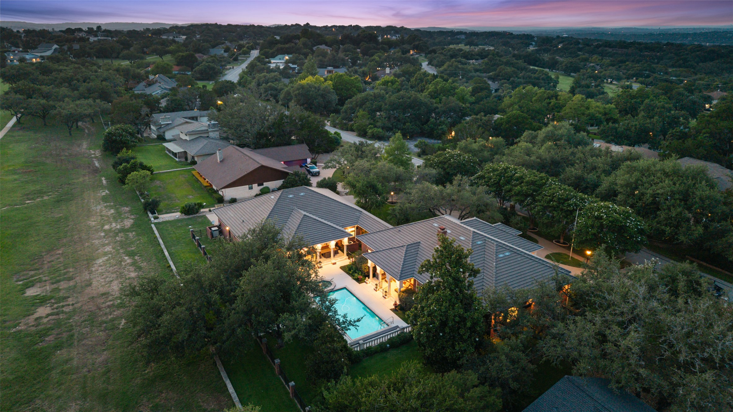 118 Lido Street Austin, TX 78734 - Photo 5 of 40 an aerial view of residential house with outdoor space and trees all around
