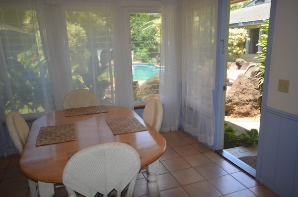 2231 Pane Road Koloa, HI 96756 - Photo 14 of 25 a living room with furniture and a floor to ceiling window