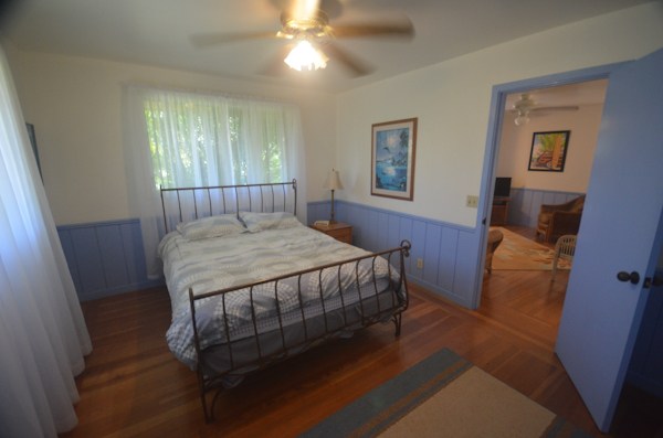 2231 Pane Road Koloa, HI 96756 - Photo 16 of 25 a bed sitting in a bedroom next to a window