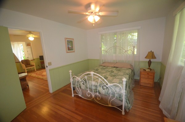 2231 Pane Road Koloa, HI 96756 - Photo 19 of 25 a bed sitting in a room next to a window