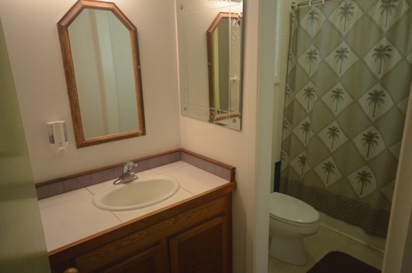 2231 Pane Road Koloa, HI 96756 - Photo 20 of 25 a bathroom with a sink toilet and shower