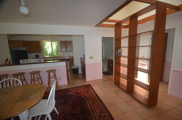 2231 Pane Road Koloa, HI 96756 - Photo 23 of 25 a kitchen with granite countertop a stove a sink and a refrigerator