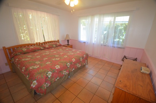 2231 Pane Road Koloa, HI 96756 - Photo 24 of 25 a bedroom with a bed and window