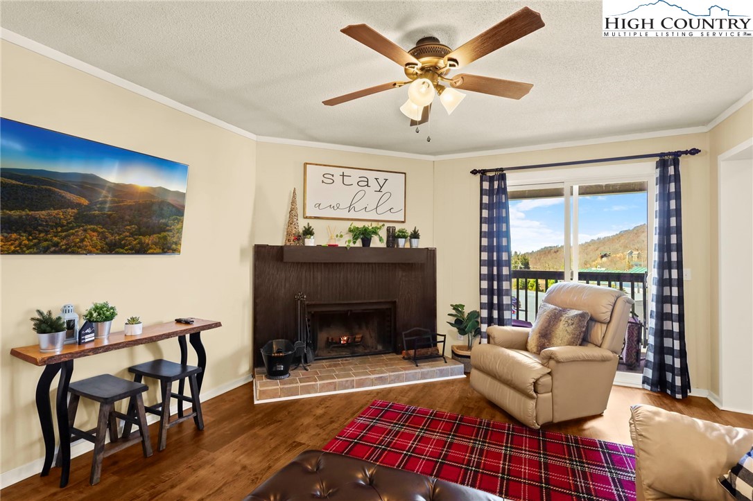 301 Pinnacle Inn Road, Unit 3305 Beech Mountain, NC 28604 - Photo 3 of 29 a living room with furniture and a fireplace