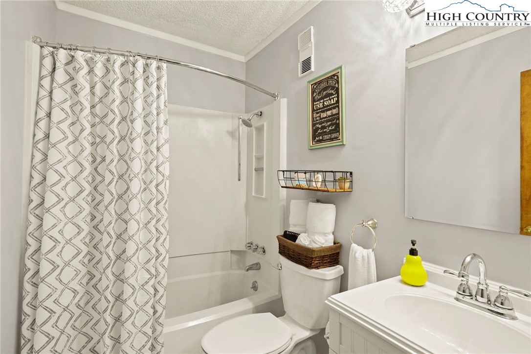 301 Pinnacle Inn Road, Unit 3305 Beech Mountain, NC 28604 - Photo 7 of 29 a bathroom with a sink toilet and shower