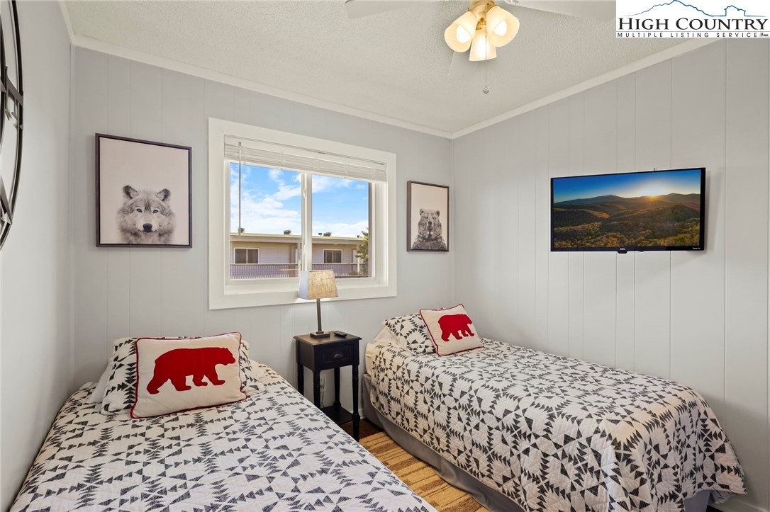 301 Pinnacle Inn Road, Unit 3305 Beech Mountain, NC 28604 - Photo 9 of 29 a bedroom with a bed and a window