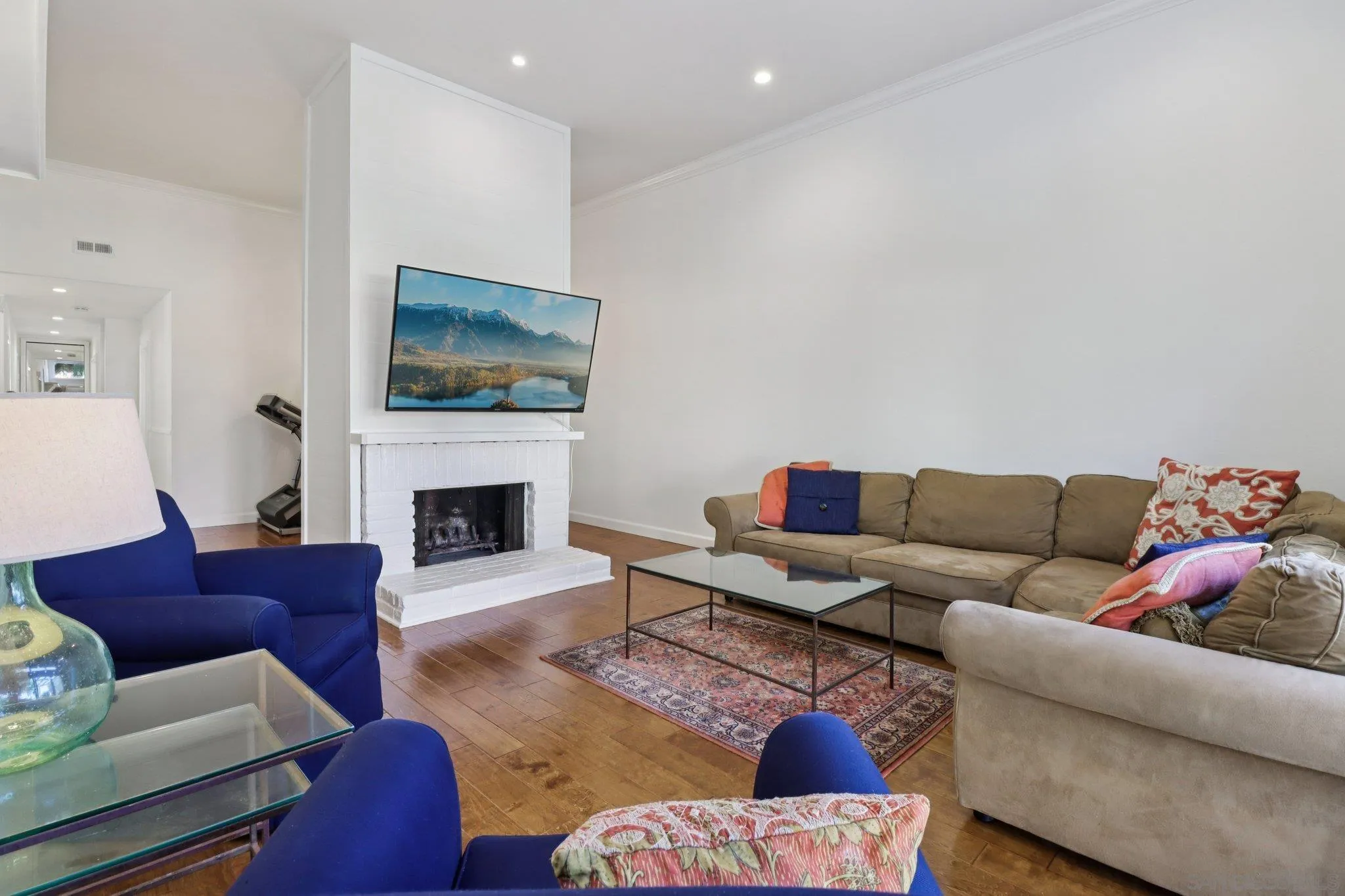 816 Caminito Azul Carlsbad, CA 92011 - Photo 11 of 41 a living room with furniture a fireplace and a flat screen tv