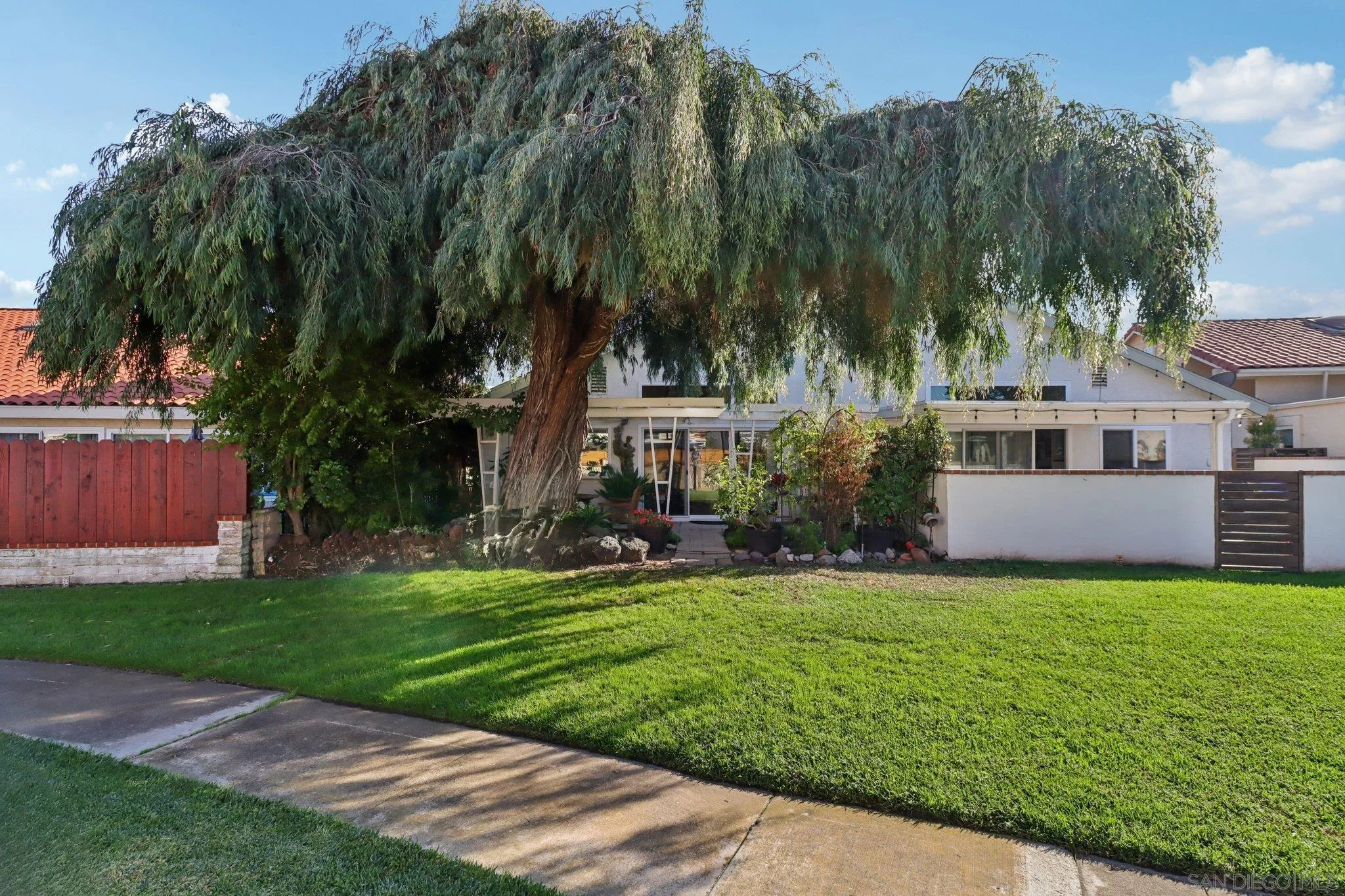 816 Caminito Azul Carlsbad, CA 92011 - Photo 33 of 41 a view of a house with garden and trees