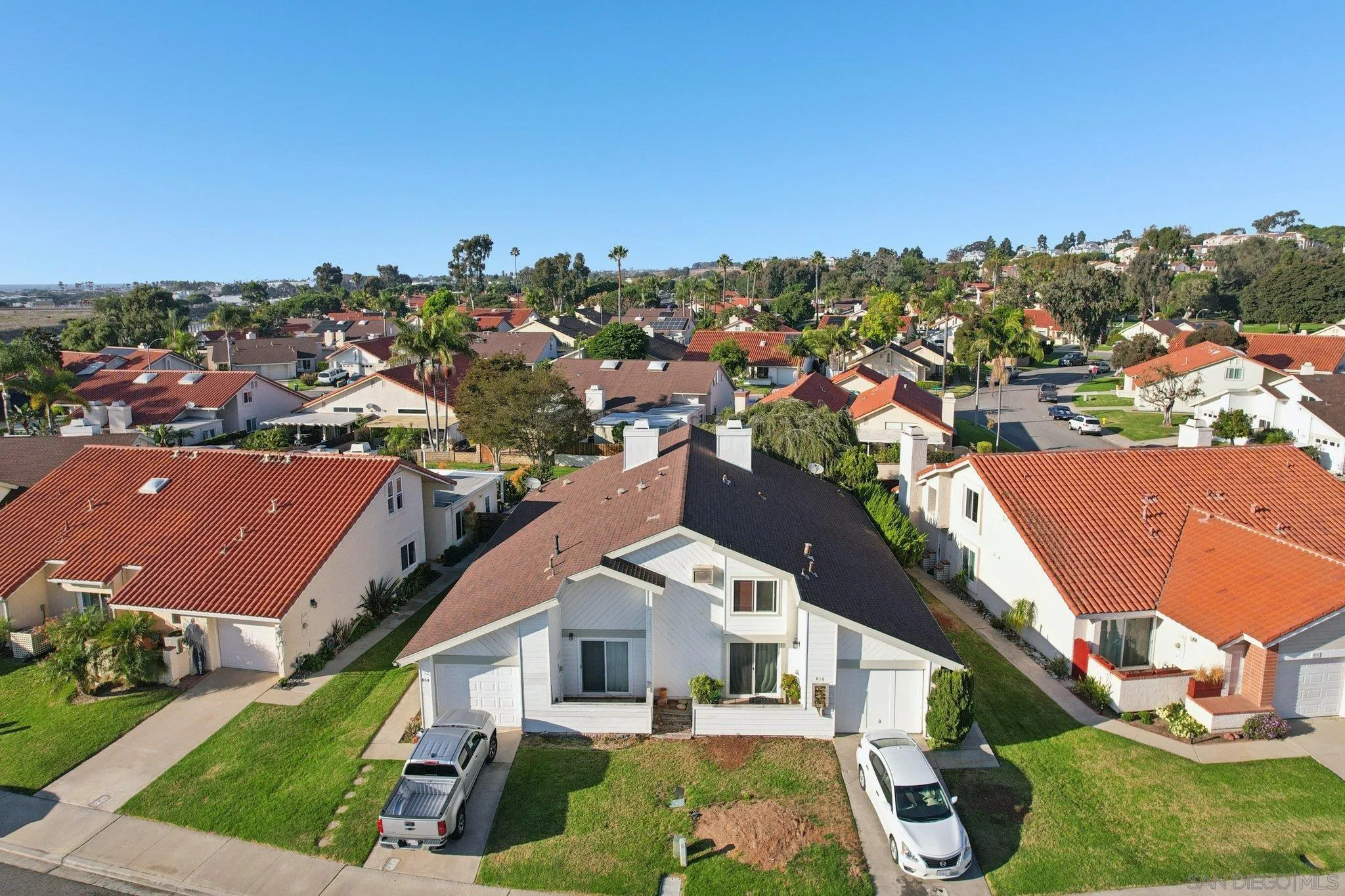 816 Caminito Azul Carlsbad, CA 92011 - Photo 37 of 41 an aerial view of multiple houses with a yard