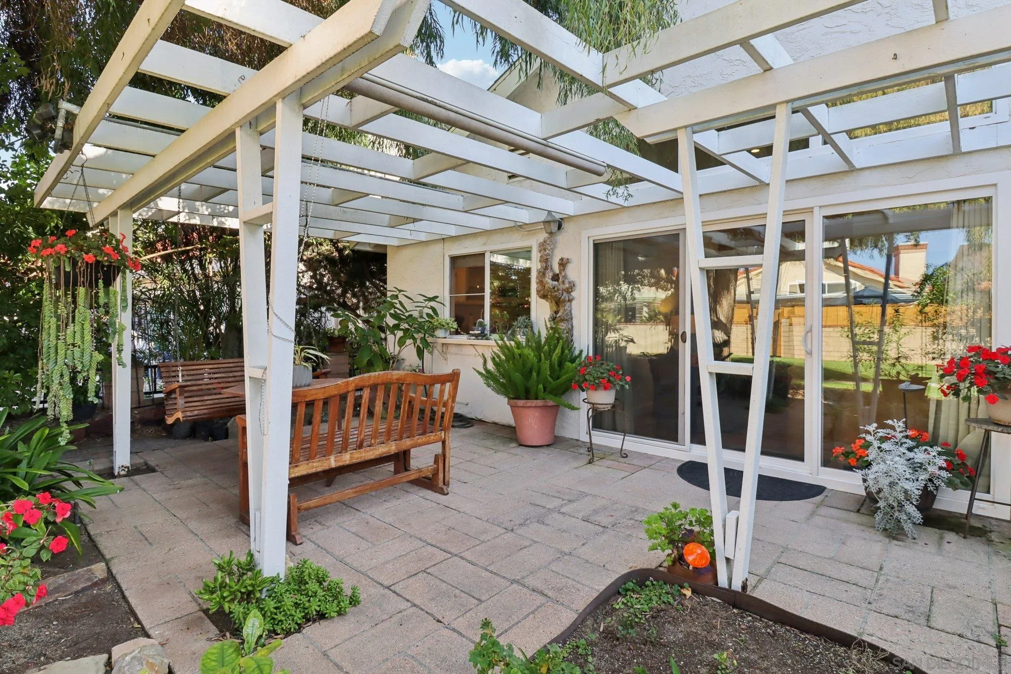 816 Caminito Azul Carlsbad, CA 92011 - Photo 5 of 41 a view of a patio with a chairs and table in a patio