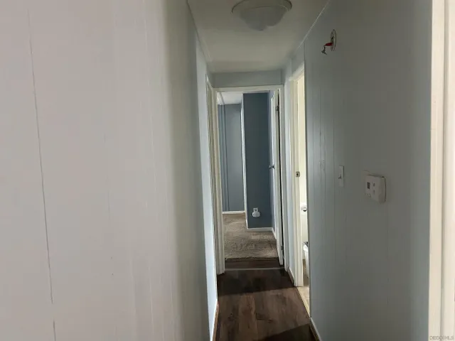 a view of a bathroom from a hallway