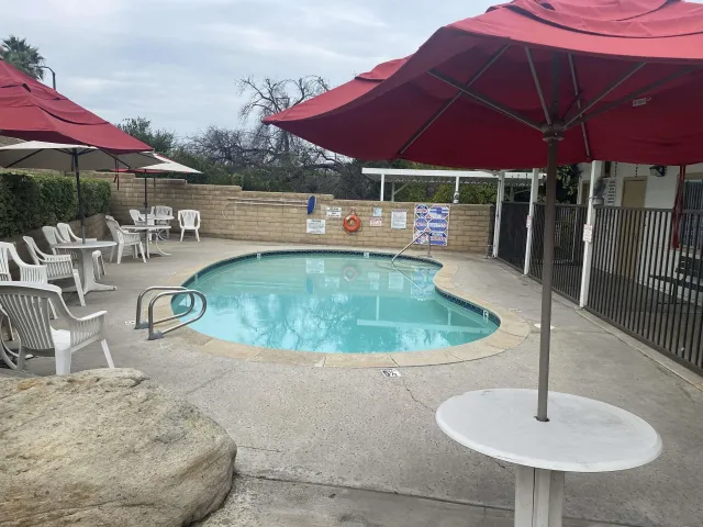 a view of a swimming pool with a patio