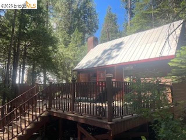 26591 Snow Bowl Road Long Barn, CA 95335 - Photo 23 of 38 a view of balcony with wooden floor and fence