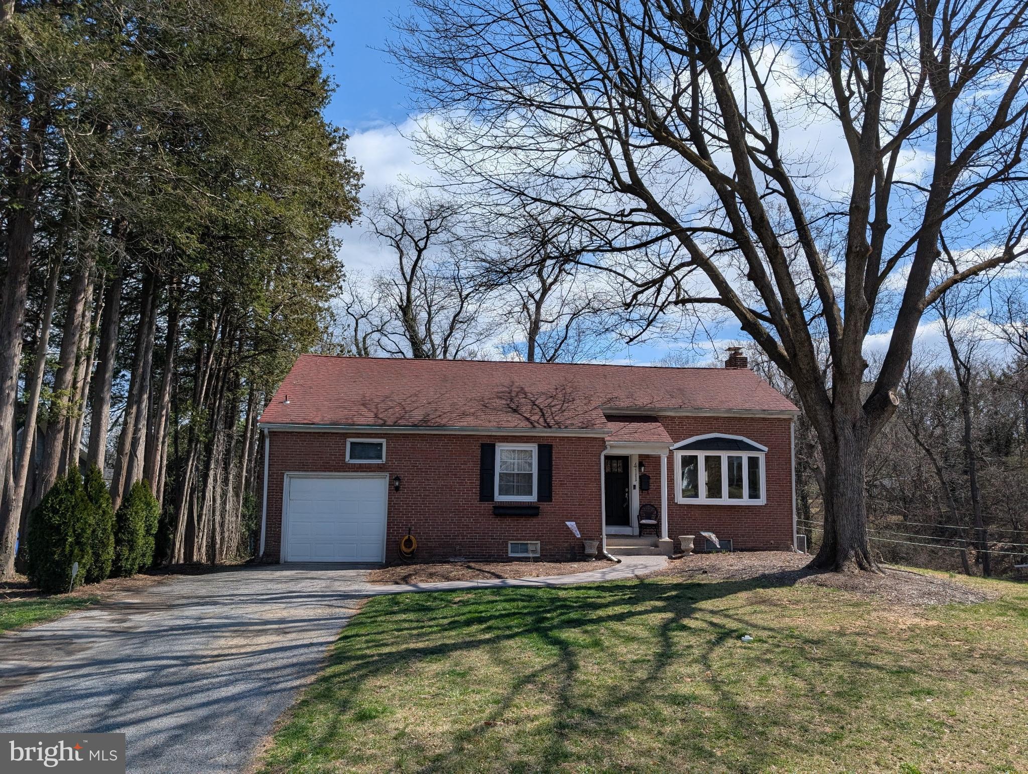 411 Devon Road Camp Hill, PA 17011 - Photo 1 of 33 a view of a yard in front of a house with large tree