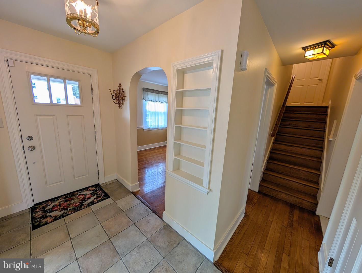 411 Devon Road Camp Hill, PA 17011 - Photo 14 of 33 a view of a hallway with wooden floor and staircase