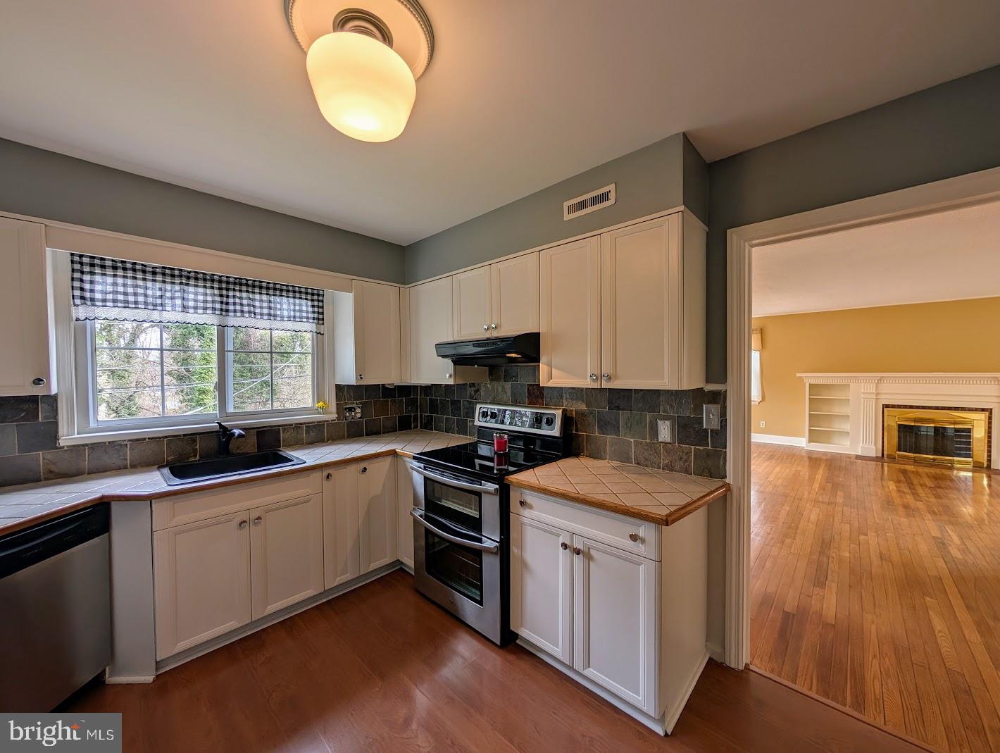 411 Devon Road Camp Hill, PA 17011 - Photo 16 of 33 a kitchen that has a sink and a stove in it