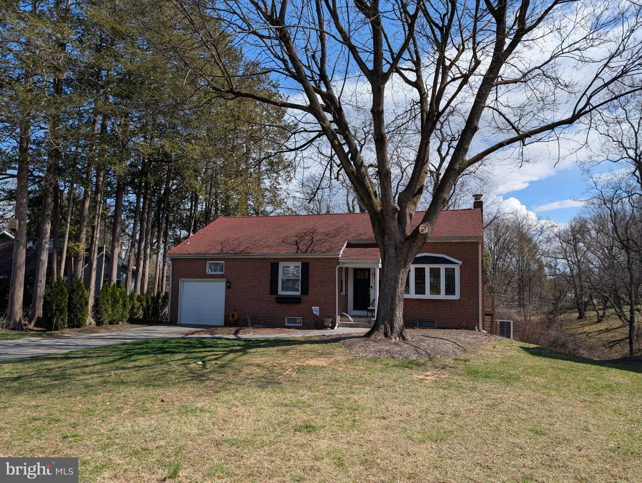 411 Devon Road Camp Hill, PA 17011 - Photo 2 of 33 a front view of a house with a yard
