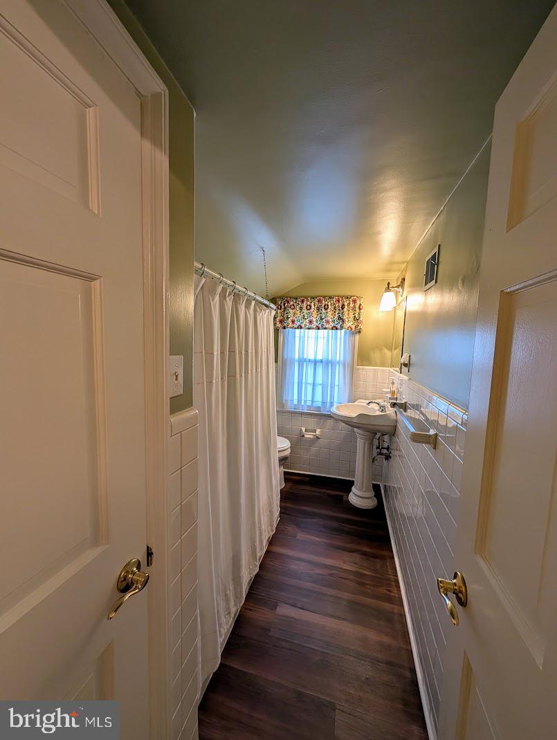 411 Devon Road Camp Hill, PA 17011 - Photo 22 of 33 a bathroom with a double vanity sink and glass door
