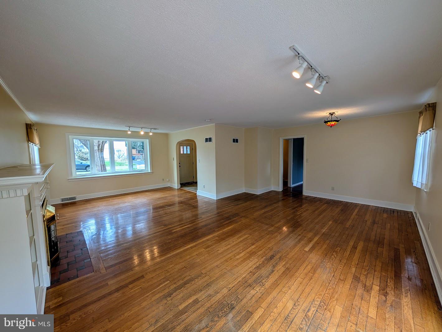 411 Devon Road Camp Hill, PA 17011 - Photo 6 of 33 a view of empty room with wooden floor and fan
