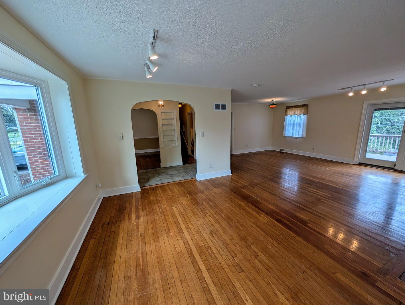 411 Devon Road Camp Hill, PA 17011 - Photo 8 of 33 a view of empty room with wooden floor