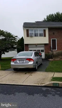 a car parked in front of a house