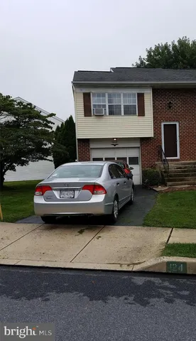 a car parked in front of a house
